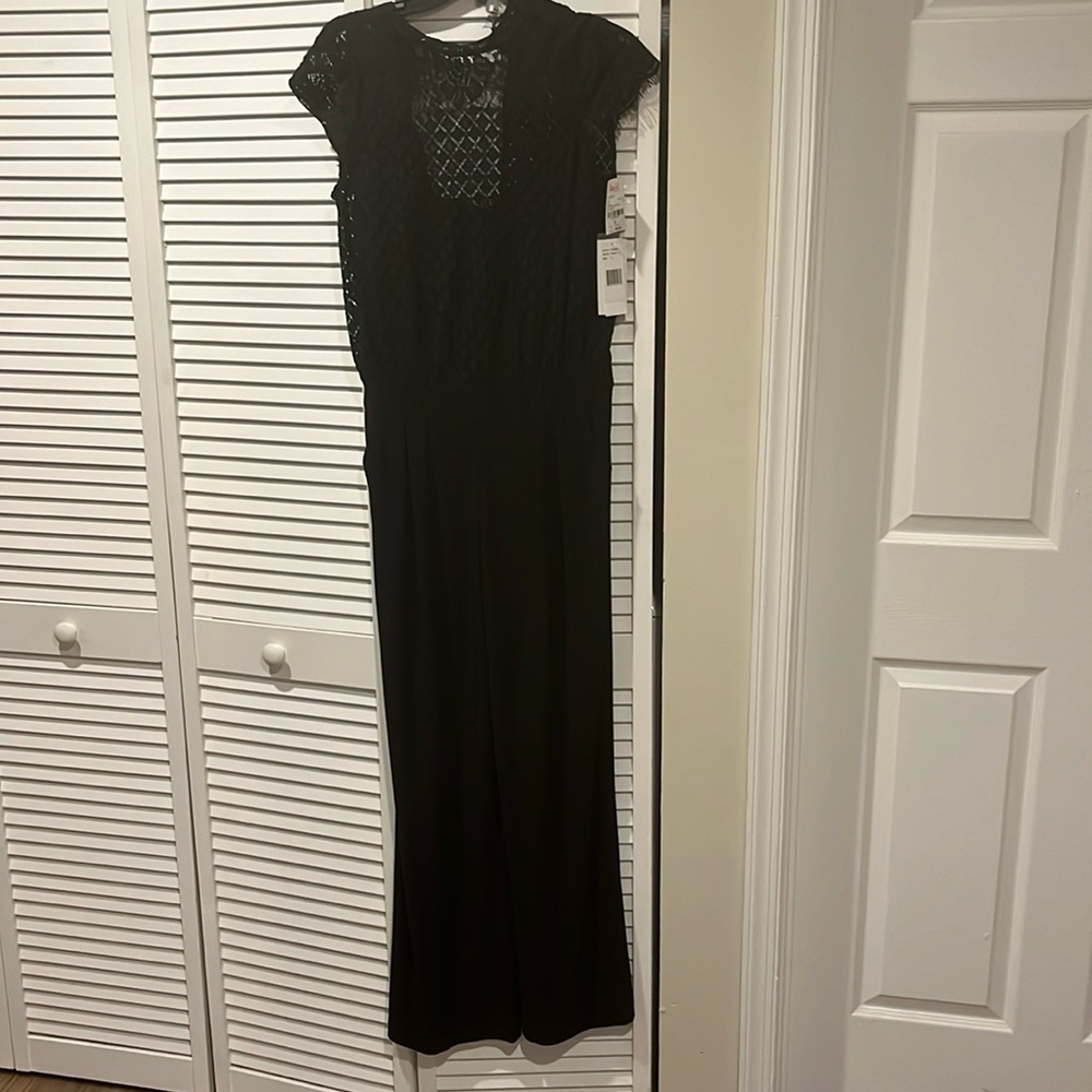 Black lace jumpsuit with pockets. Size 4 NWT